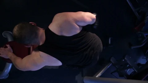 Male athlete doing exercise with triceps dumbbells Stock Footage 111563074