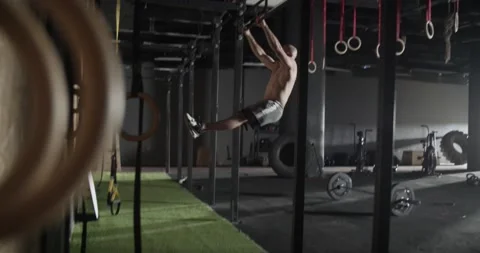 Male athlete doing pull ups in gym Stock Footage 172326904