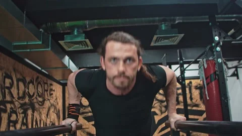 Male athlete doing push-ups in the gym Stock Footage 153587724