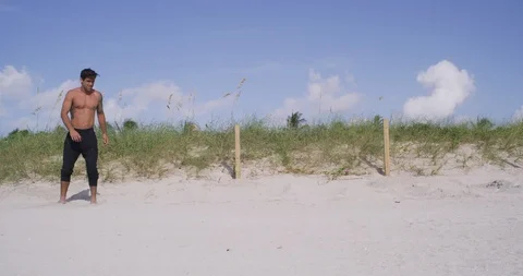 Male athlete falling off down at the beach while working out Stock Footage 97273370