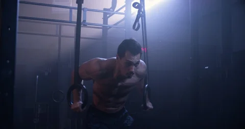 Male athlete performing ring dips Stock Footage 104005747