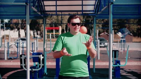 Male athlete throws the ball while standing on the sports ground Stock Footage 147925005