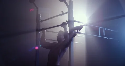 Male athlete training on a pull up bar Stock Footage 104005651