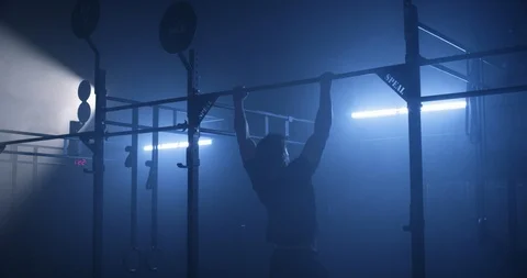 Male athlete training on a pull up bar performing pull ups Stock Footage 104006621