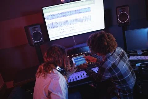 Male audio engineers using digital tablet 写真素材