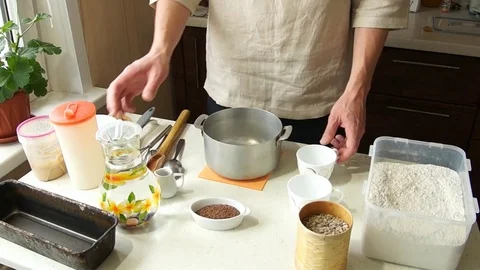 Male baker prepares to bake bread Stock Footage 77568223