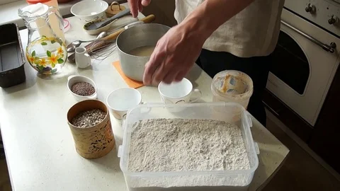 Male baker prepares to bake bread Stock Footage 77784798