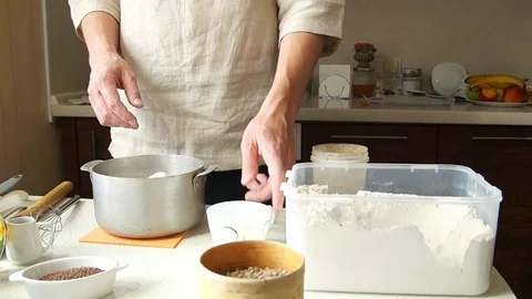Male baker prepares to bake bread Stock Footage 77953743
