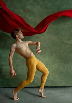 Male ballet dancer doing exercise, dancing studio Stock Photos