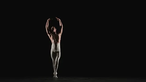 Male ballet dancer performs ballet dance elements Stock Footage 151694008