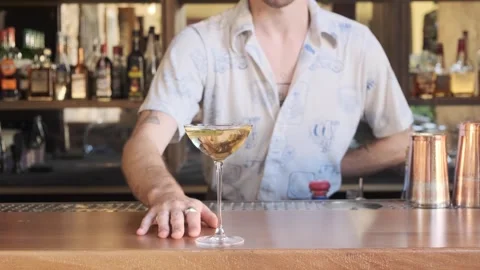 Male Bartender Creating Drinks in Old-Fashioned Bar Stock Footage 318658138