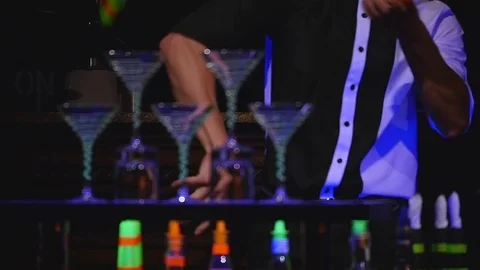 Male bartender juggling bottle and make cocktail. Barman show, clear shots, man Stock Footage