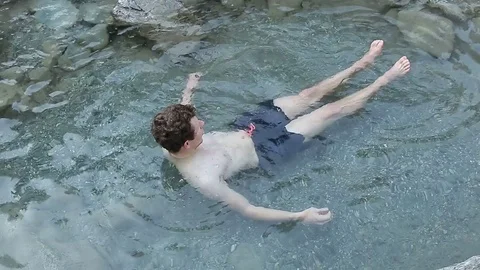 Male bathing in ice cold river Stock Footage 72195466