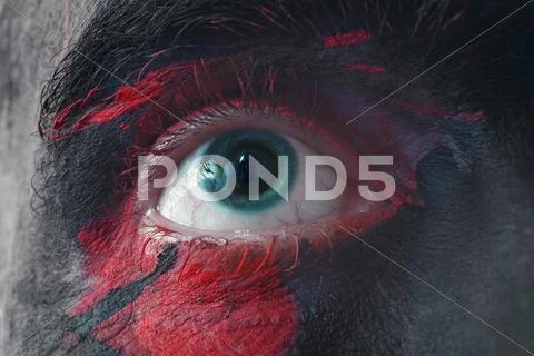 Male blue eyes bright with war paint Stock Photos