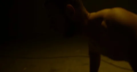 Male Body Builder Doing Press Up's In A Dark Room,Training For Weight Lifting Stock Footage 113293956