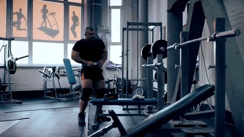 Male bodybuilder doing squats with a barbell at the gym Stock Footage 70453056