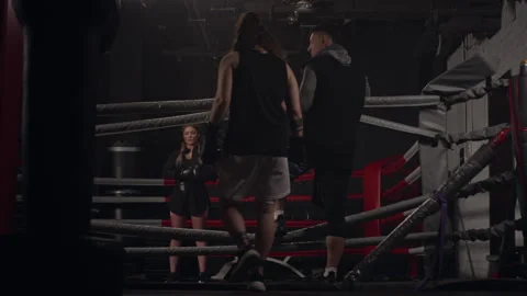 Male Boxer Entering Ring for Training with Coach and Woman Stock Footage 340395824