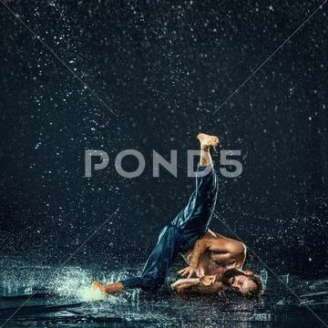 The male break dancer in water Stock Photos