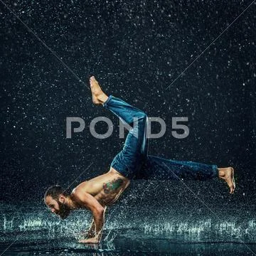 The male break dancer in water Stock Photos
