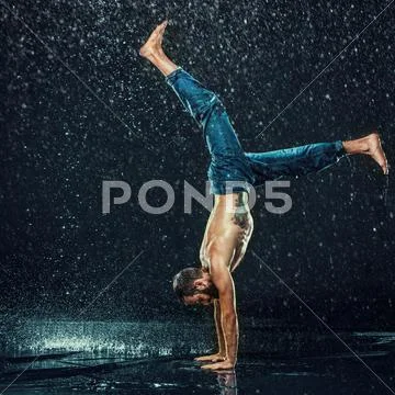 The male break dancer in water Stock Photos