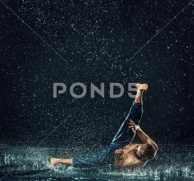 The male break dancer in water Stock Photos