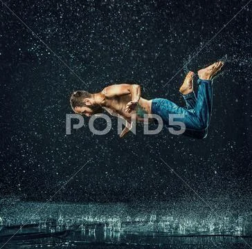 The male break dancer in water Stock Photos