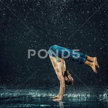 The male break dancer in water Stock Photos