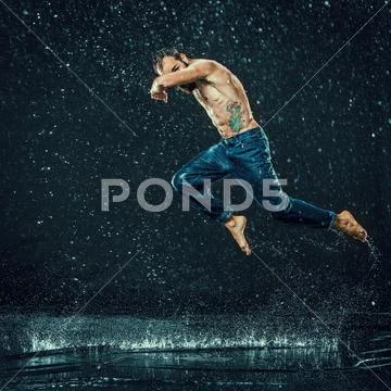 The male break dancer in water Stock Photos