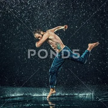 The male break dancer in water Stock Photos