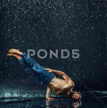 The male break dancer in water Stock Photos