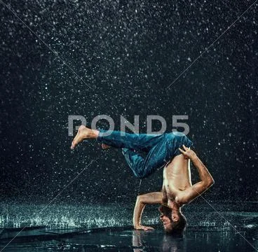The male break dancer in water Stock Photos