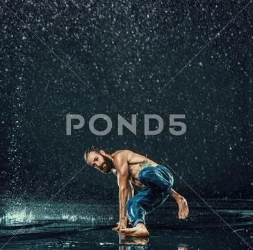The male break dancer in water Stock Photos
