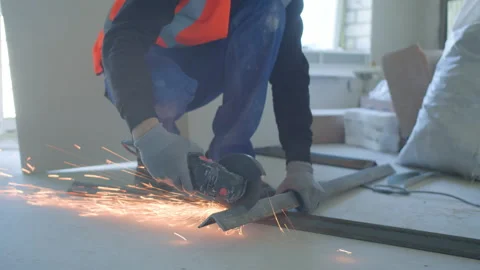 Male builder cutting metal detail during work Stock-Footage 154394553