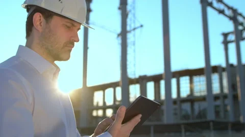 Male builder engineer man worker builder architect in hard hat with tablet Stock Footage 157665744