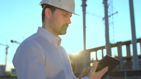 Male builder engineer man worker builder architect in hard hat with tablet Stock Footage 157665772