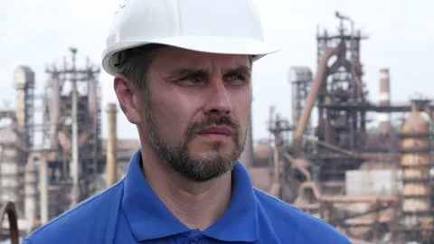 Male builder engineer man worker in hard hat working outside metallurgical plant Stock Footage 163352173