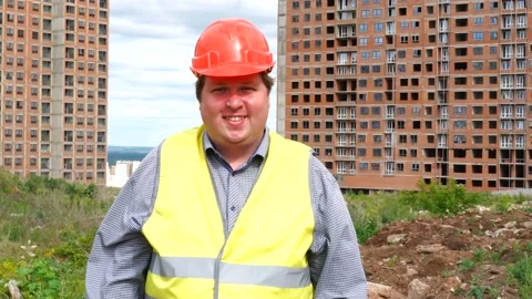 Male builder foreman or architect working on construction building site standing Stock Footage 111864449