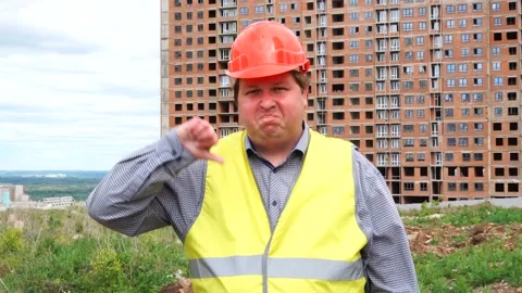 Male builder foreman, worker or architect on construction building site showing Stock-Footage 111859425
