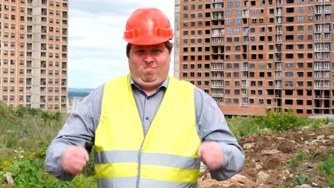 Male builder foreman, worker or architect on construction building site imitates Stock Footage 111860733
