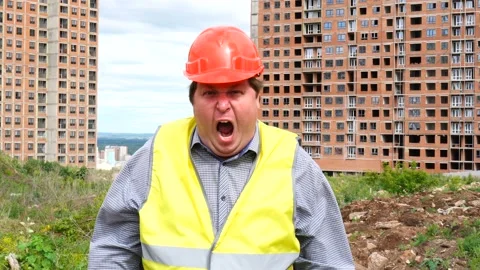 Male builder foreman, worker or architect on construction building site is Vídeos de archivo 111862392