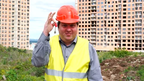 Male builder foreman, worker or architect on construction building site showing 스톡 동영상 111866084