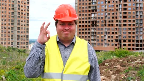 Male builder foreman, worker or architect on construction building site showing Stock Footage 111866221