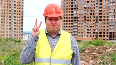 Male builder foreman, worker or architect on construction building site showing Stock-Footage 111866662