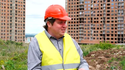 Male builder foreman, worker or architect on construction building site talking Stock Footage 111869059