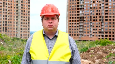 Male builder foreman, worker or architect on construction building site looking Stock Footage 111872169