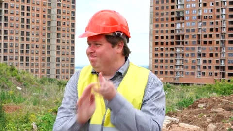 Male builder foreman, worker or architect on construction building site shake Stock Footage 111875393
