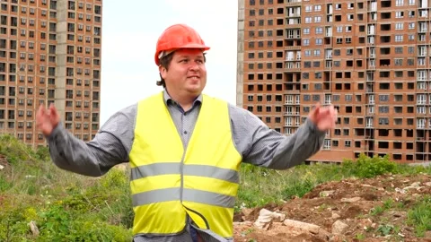 Male builder foreman, worker or architect on construction building site proudly Stock-Footage 111876200