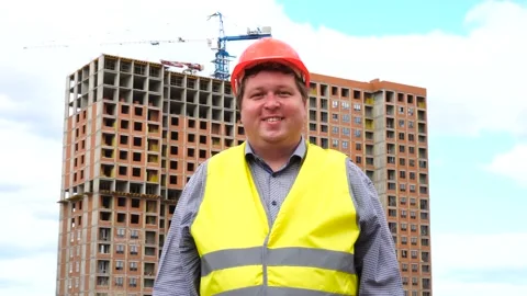 Male builder foreman, worker or architect on construction building site smiling Stock Footage 111876479