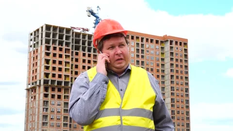 Male builder foreman, worker or architect on construction building site talking Stock Footage 111877141