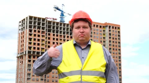 Male builder foreman, worker or architect on construction building site showing Stock-Footage 111878661
